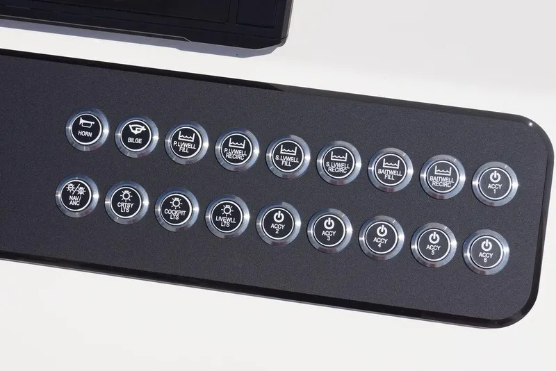 Slide: The Image of Control panel of 2026 Skeeter SX241 boat with labeled buttons for various functions. - 24