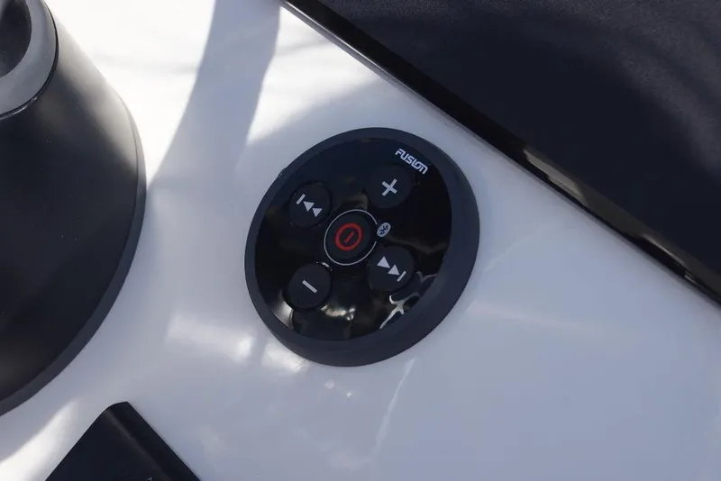 Slide: The Image of Control panel on 2026 Skeeter SX241 boat, featuring Fusion audio system. - 25