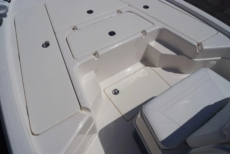 Slide: The Image of 2026 Skeeter SX241 boat interior with white seating and storage compartments. - 27