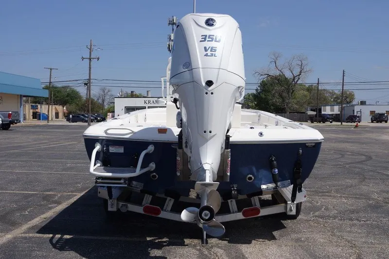 Slide: The Image of 2026 Skeeter SX241 boat with powerful V6 engine in a parking lot. - 3
