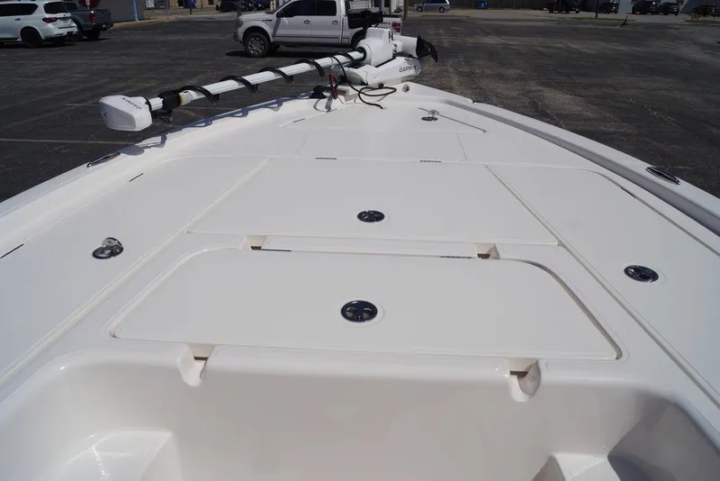 Slide: The Image of 2026 Skeeter SX241 boat deck with storage compartments and trolling motor. - 30