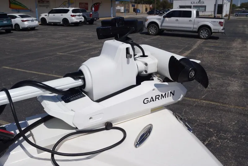 Slide: The Image of Trolling motor with Garmin technology on a 2026 Skeeter SX241 boat in a parking lot. - 34