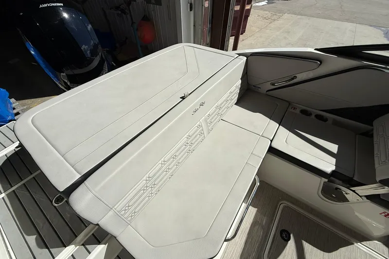 Slide: The Image of 2025 Sea Ray 19 SPX OB boat interior with cushioned seating and sleek design. - 10