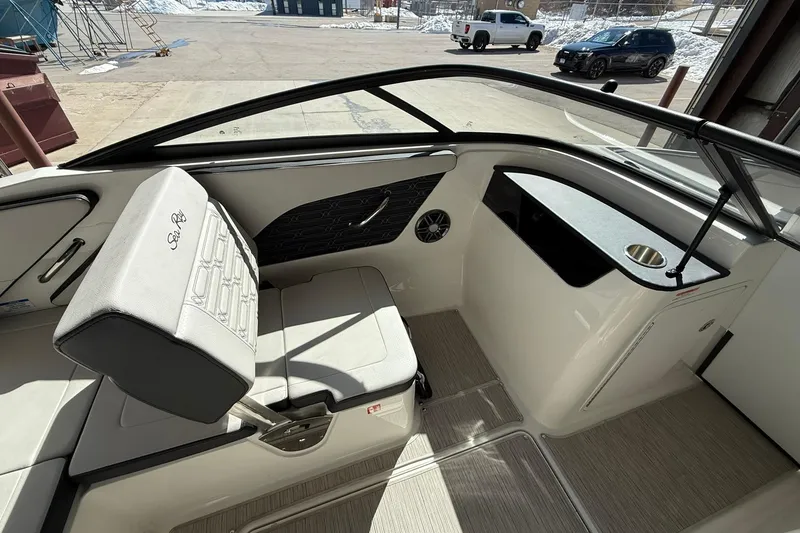 Slide: The Image of Interior of 2025 Sea Ray 19 SPX OB boat, featuring seating and cup holder. - 15