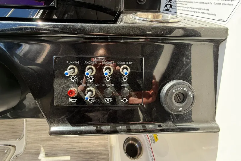 Slide: The Image of Control panel of a 2025 Sea Ray 19 SPX OB boat with switches and ignition. - 19