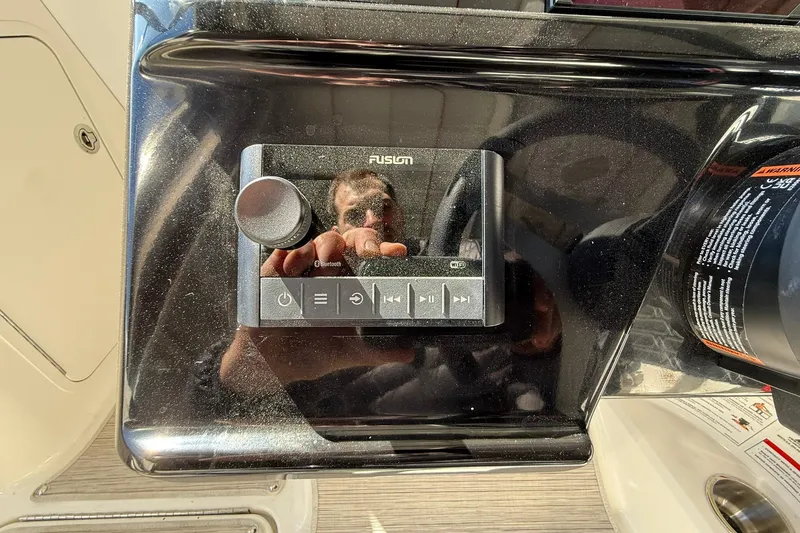 Slide: The Image of Fusion audio control panel on 2025 Sea Ray 19 SPX OB boat dashboard. - 20