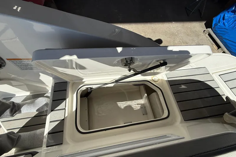 Slide: The Image of Open storage compartment on 2025 Sea Ray 19 SPX OB boat deck. - 22
