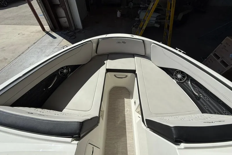 Slide: The Image of 2025 Sea Ray 19 SPX OB boat interior with cushioned seating and sleek design. - 9