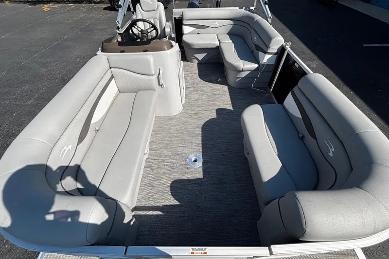 Slide: The Image of 2023 Bennington 188SLJ pontoon boat interior with gray seating and steering console. - 10