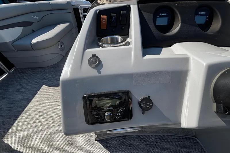 Slide: The Image of 2023 Bennington 188SLJ boat dashboard with controls and seating area. - 7