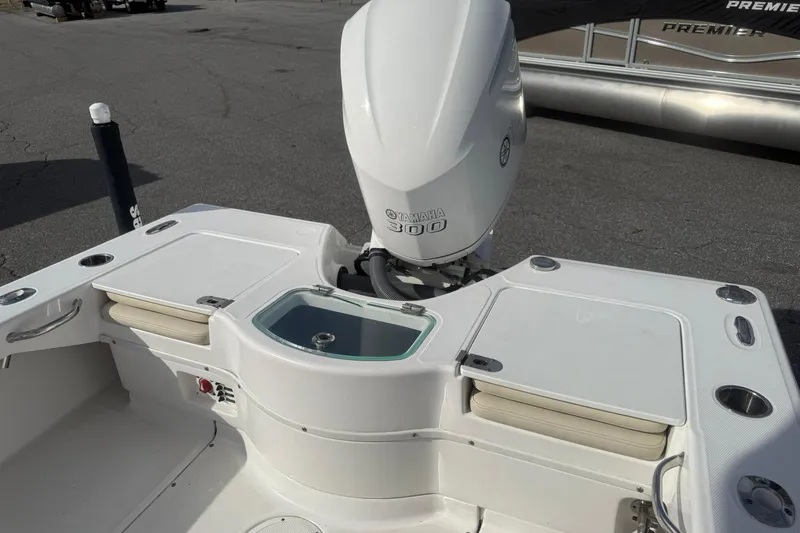 Slide: The Image of 2016 Everglades 243 Center Console boat with Yamaha 300 engine, featuring seating and storage. - 11