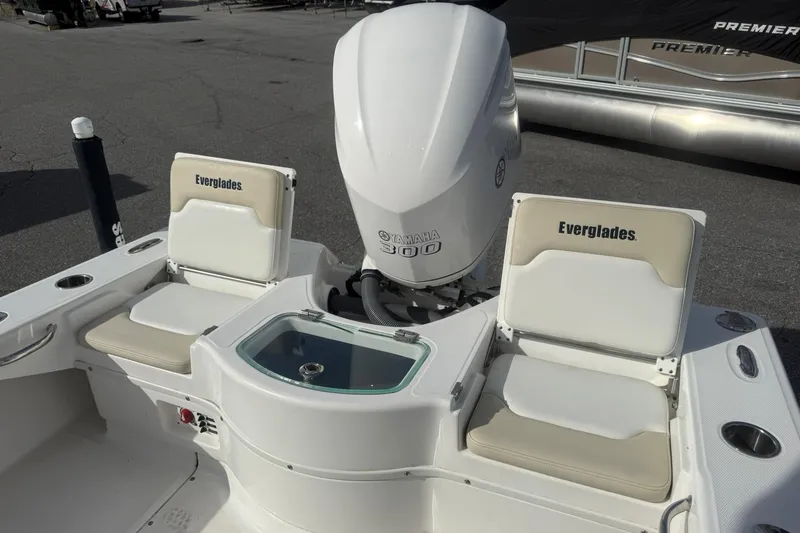Slide: The Image of 2016 Everglades 243 Center Console boat with Yamaha 300 engine, featuring seating and storage. - 12