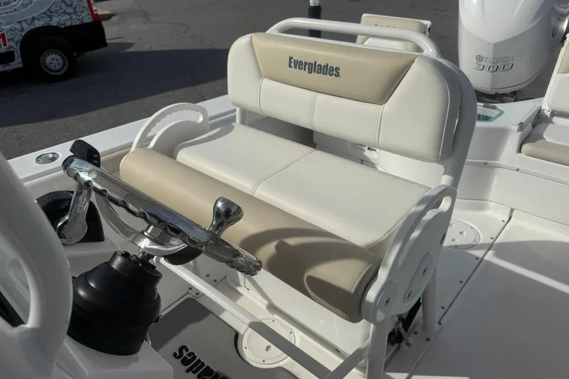 Slide: The Image of 2016 Everglades 243 Center Console boat interior with steering wheel and seating. - 17