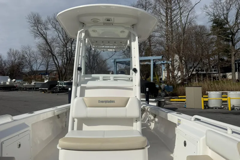 Slide: The Image of 2016 Everglades 243 Center Console boat in a marina setting. - 21
