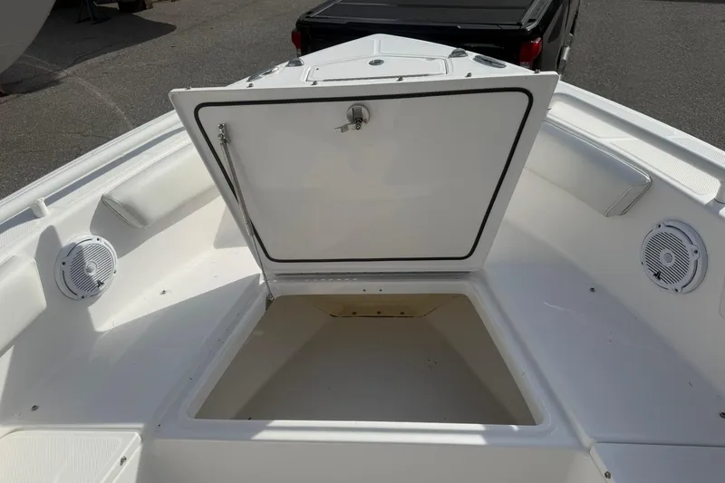 Slide: The Image of Open storage compartment on 2016 Everglades 243 Center Console boat deck. - 23