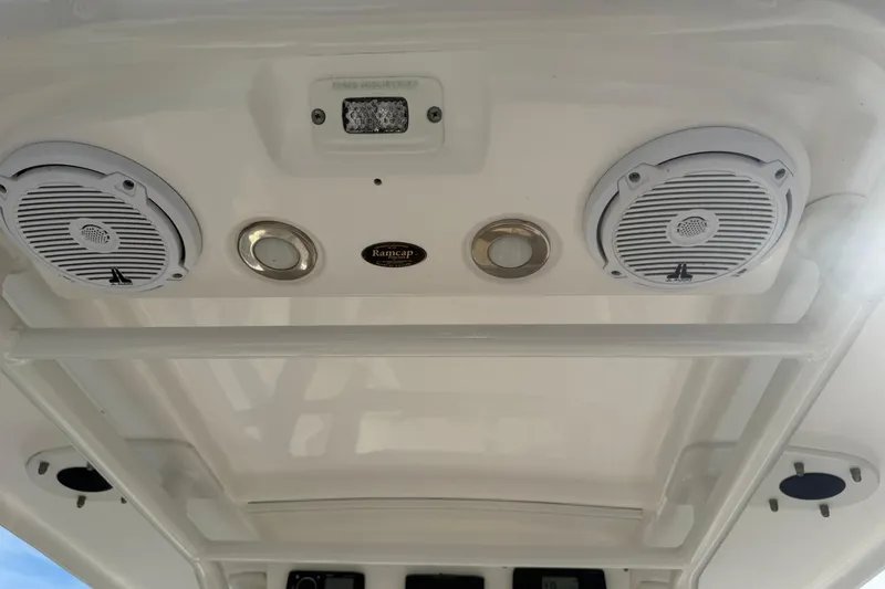 Slide: The Image of Ceiling view of 2016 Everglades 243 Center Console with speakers and lights. - 31
