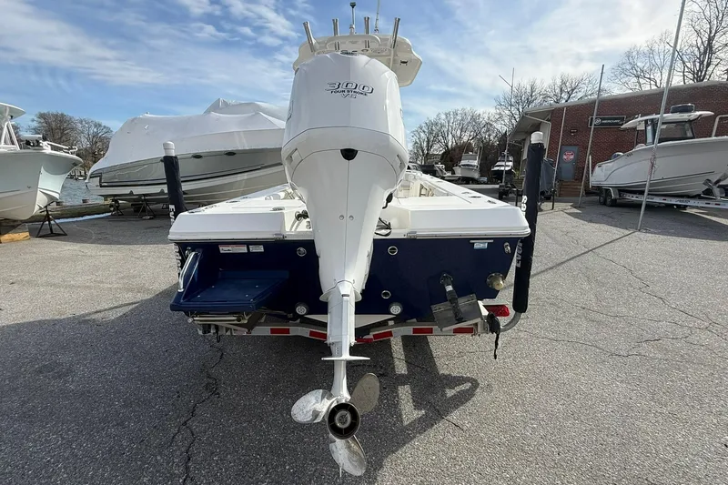 Slide: The Image of Rear view of a 2016 Everglades 243 Center Console boat with outboard motor. - 4
