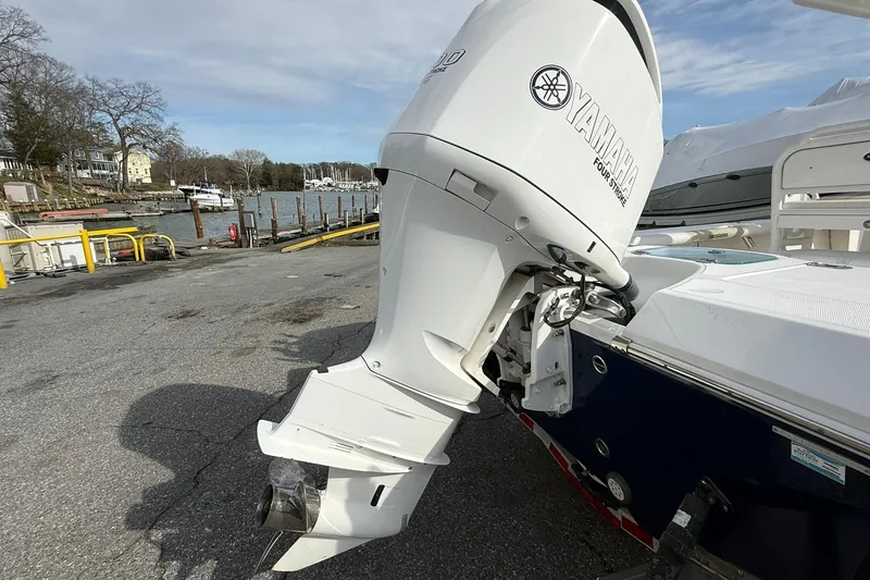 Slide: The Image of 2016 Everglades 243 Center Console with Yamaha outboard motor at dockside. - 5