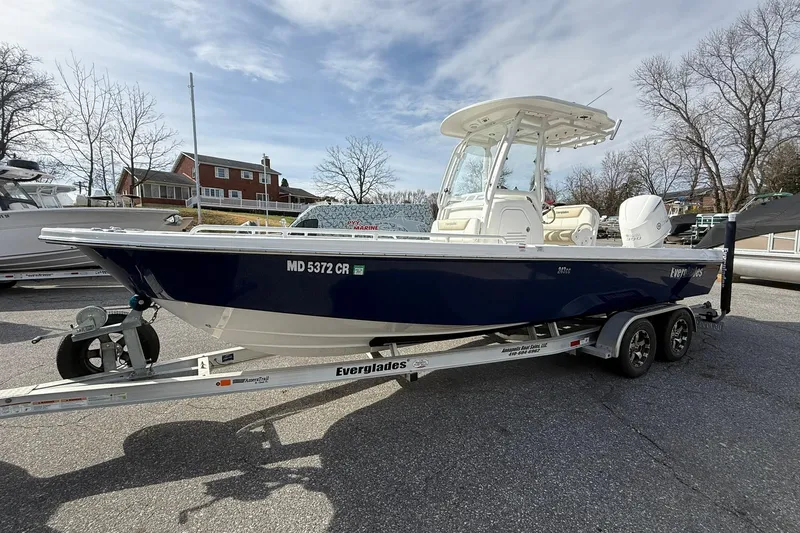 Slide: The Image of 2016 Everglades 243 Center Console boat on trailer, parked outdoors. - 8