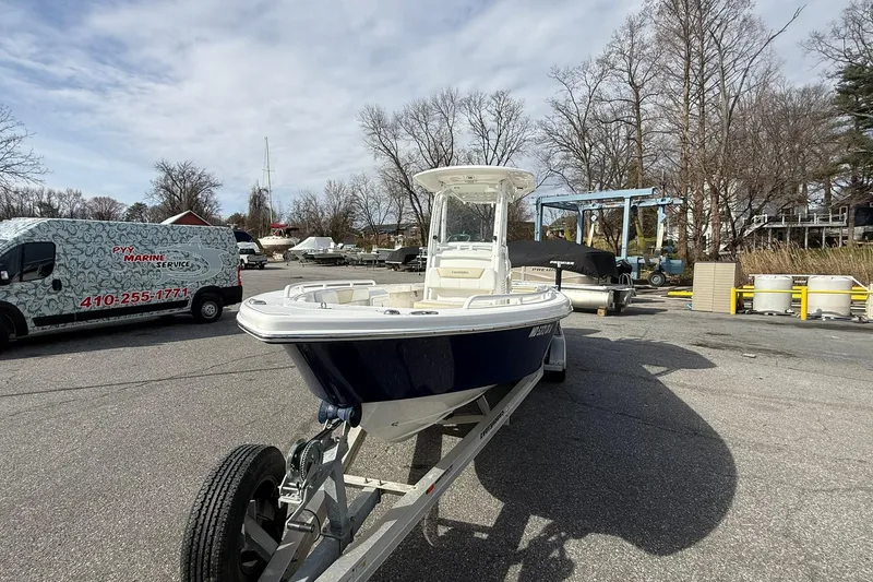 Slide: The Image of 2016 Everglades 243 Center Console boat on trailer at marina service area. - 9