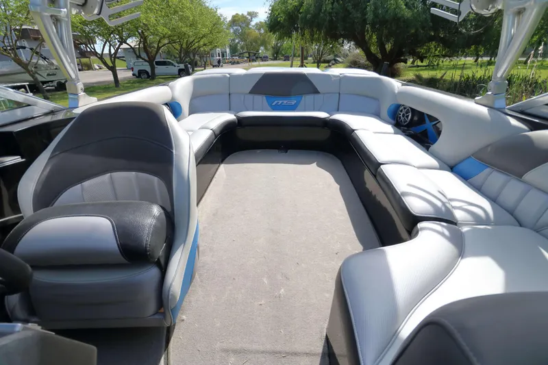 Slide: The Image of Interior of 2012 MB B-52 23 Widebody boat with spacious seating and modern design. - 11