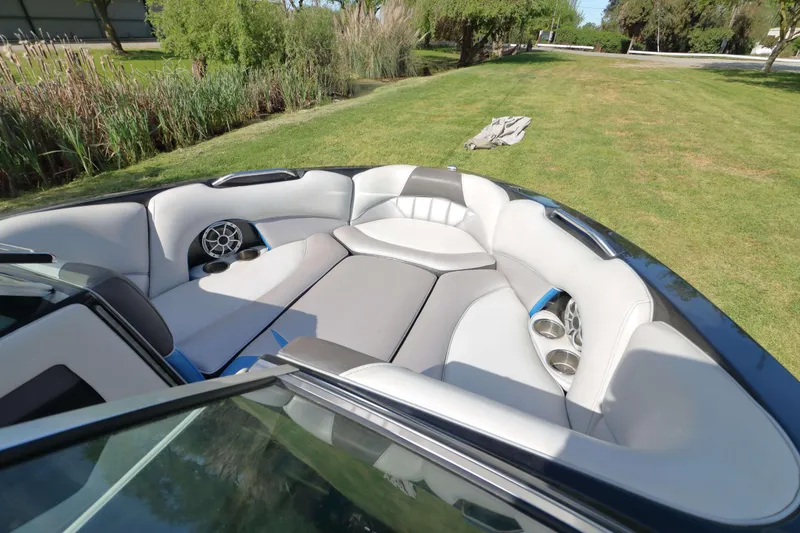 Slide: The Image of Luxurious interior of 2012 MB B-52 23 Widebody boat with plush seating and speakers. - 12