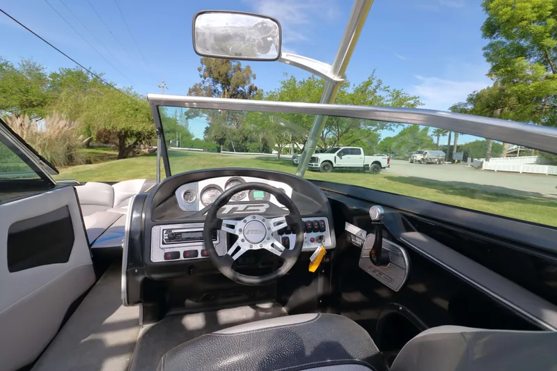 Slide: The Image of Interior view of 2012 MB B-52 23 Widebody boat with steering wheel and dashboard. - 13