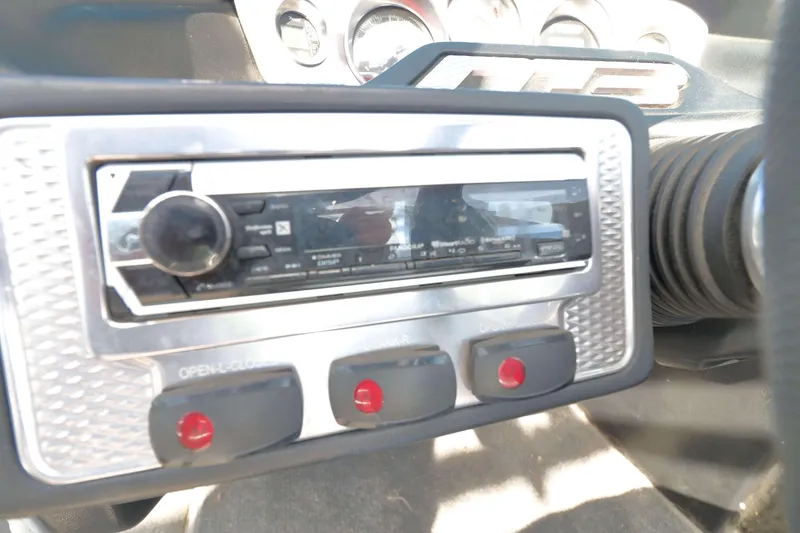 Slide: The Image of Dashboard of a 2012 MB B-52 23 Widebody with stereo system and controls. - 14