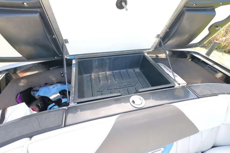 Slide: The Image of Open storage compartment in a 2012 MB B-52 23 Widebody boat. - 18