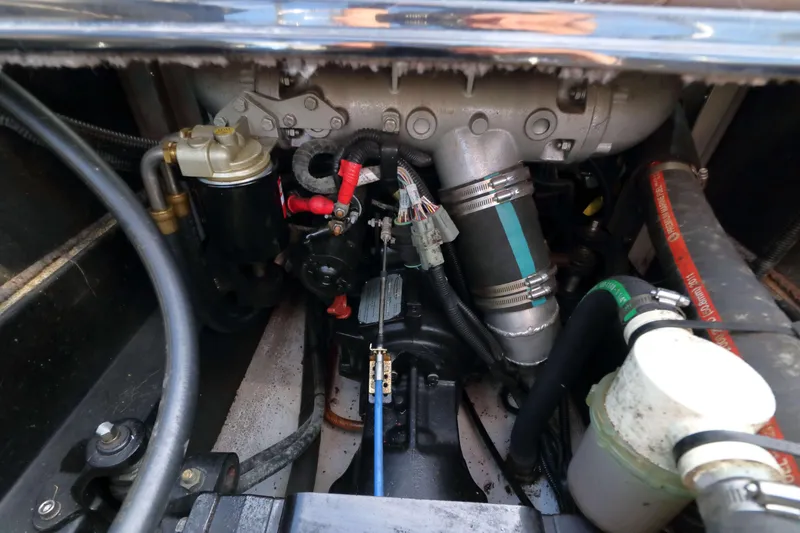 Slide: The Image of Engine compartment of a 2012 MB B-52 23 Widebody boat, showcasing mechanical components. - 19