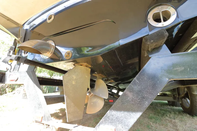 Slide: The Image of 2012 MB B-52 23 Widebody boat underside with propeller and exhaust details. - 5