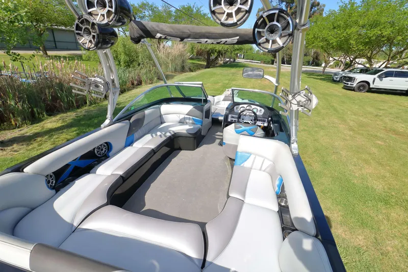 Slide: The Image of 2012 MB B-52 23 Widebody boat interior with spacious seating and audio system. - 8