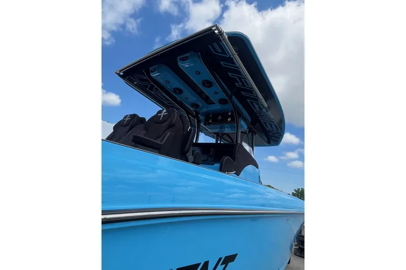 Slide: The Image of Blue 2025 Statement 350 Open boat with sleek design under a cloudy sky. - 12