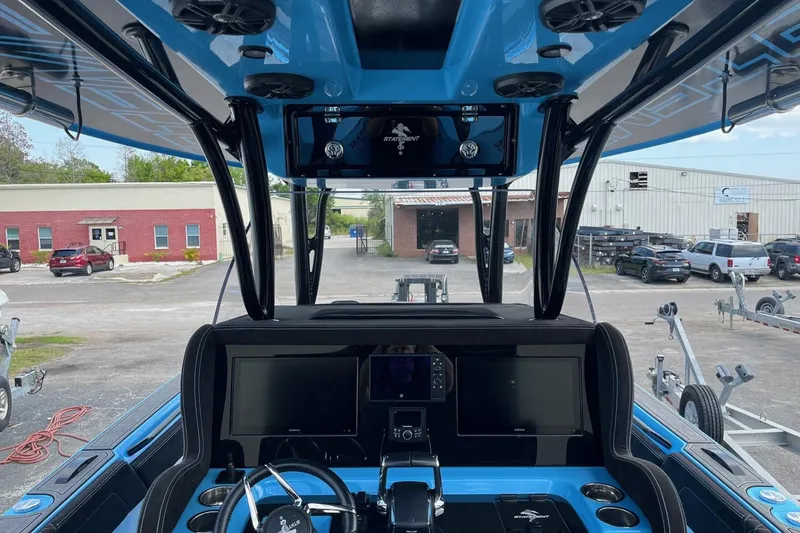 Slide: The Image of Interior view of 2025 Statement 350 Open boat with advanced navigation system. - 14