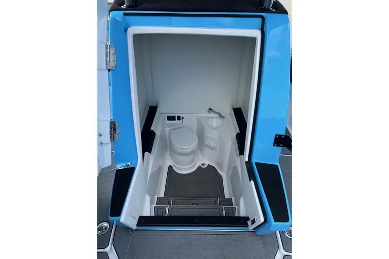 Slide: The Image of 2025 Statement 350 Open boat interior with compact bathroom and toilet. - 19