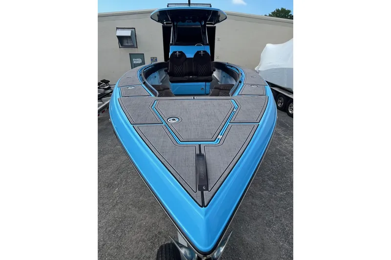 Slide: The Image of 2025 Statement 350 Open boat with sleek blue design and spacious deck. - 3