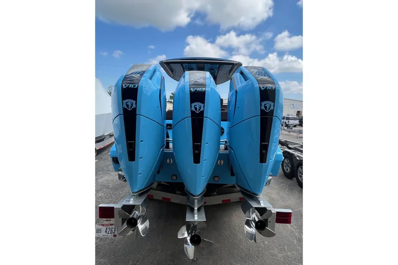 Slide: The Image of Four blue V10 outboard motors on a 2025 Statement 350 Open boat. - 4