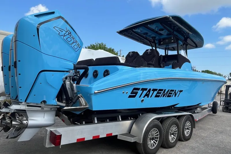Slide: The Image of 2025 Statement 350 Open boat with twin 400 engines on a trailer. - 9