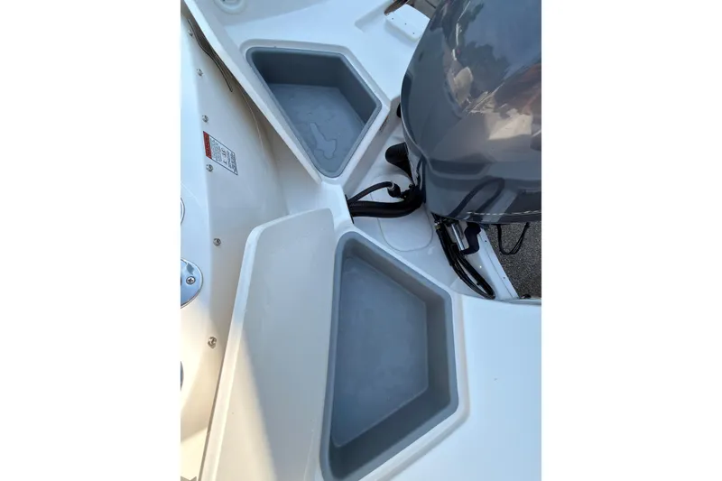 Slide: The Image of 2023 Stingray 201 DC boat seat, white and gray upholstery, ergonomic design. - 16