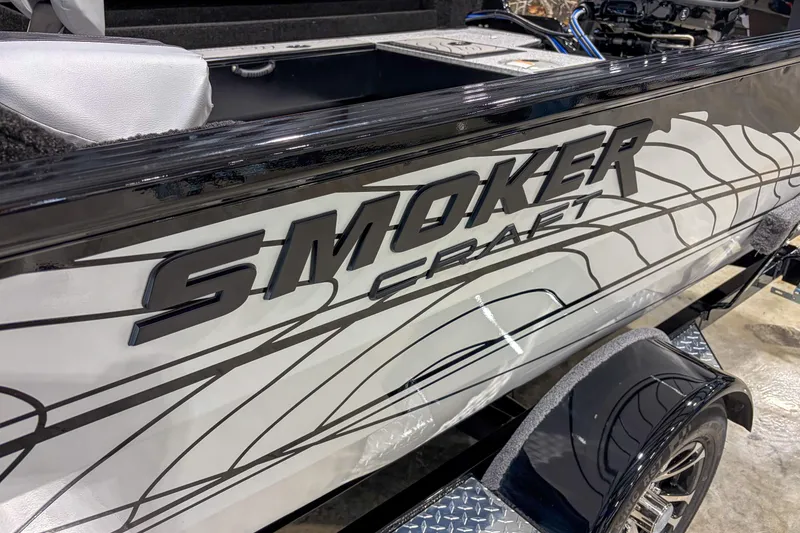 Slide: The Image of 2026 Smoker Craft Excursion 176 DC boat with sleek design and bold graphics. - 3