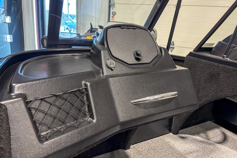 Slide: The Image of 2026 Smoker Craft Excursion 176 DC dashboard with storage compartment and netting. - 8