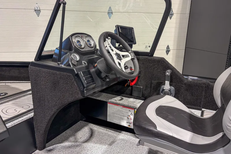 Slide: The Image of 2026 Smoker Craft Excursion 176 DC boat interior with steering wheel and dashboard controls. - 9