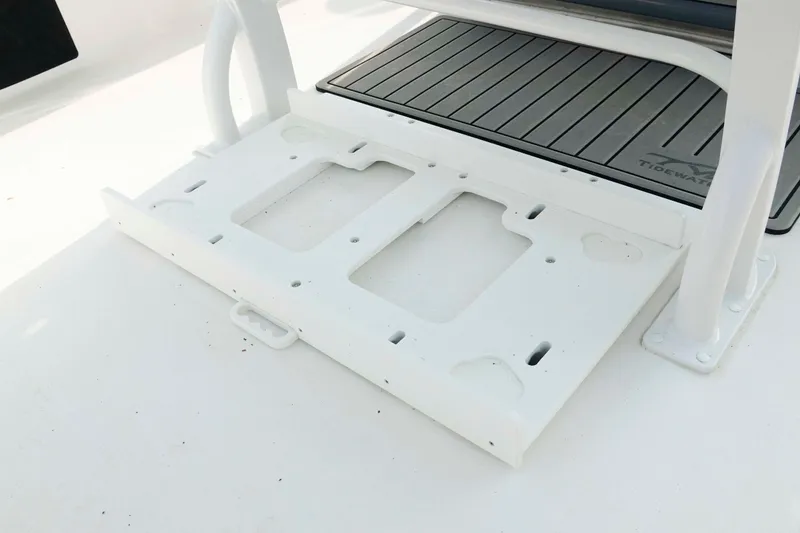 Slide: The Image of 2026 Tidewater 2300 Carolina Bay boat deck with white mounting bracket. - 10