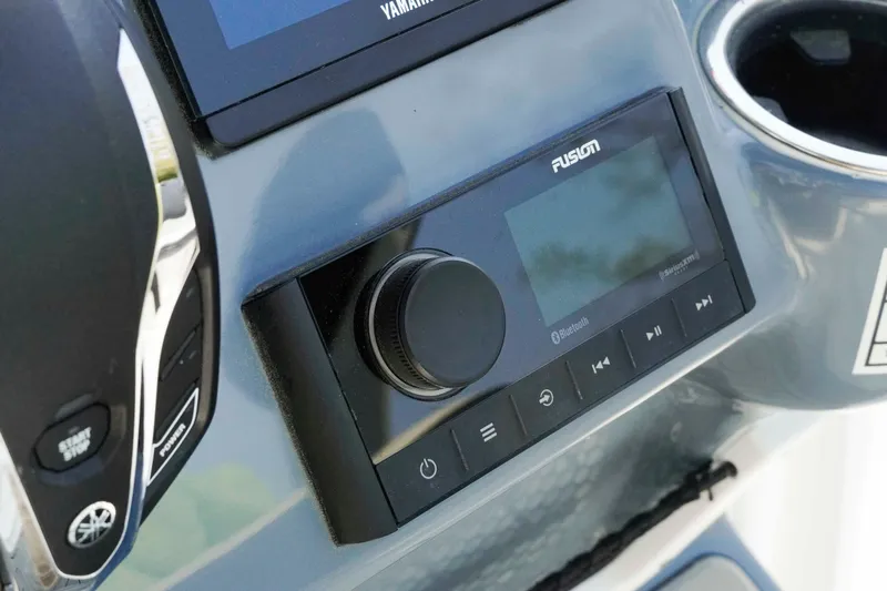 Slide: The Image of Control panel of 2026 Tidewater 2300 Carolina Bay boat with Fusion audio system. - 14