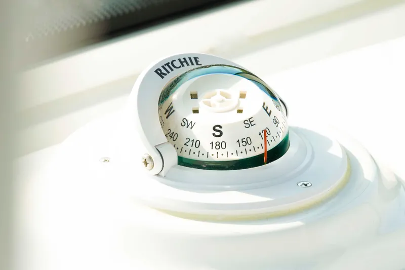 Slide: The Image of Compass on 2026 Tidewater 2300 Carolina Bay boat dashboard. - 15