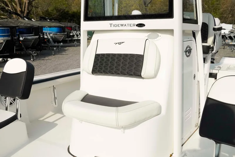 Slide: The Image of 2026 Tidewater 2300 Carolina Bay boat interior with cushioned seating and console. - 16