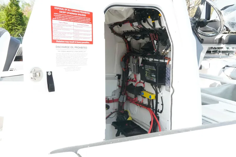 Slide: The Image of Electrical wiring inside a 2026 Tidewater 2300 Carolina Bay boat console. - 17