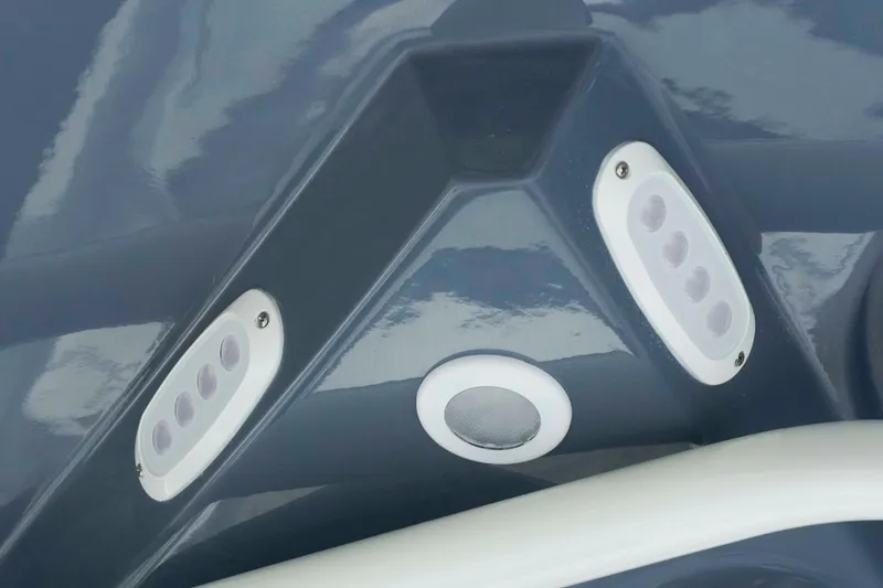 Slide: The Image of 2026 Tidewater 2300 Carolina Bay boat detail with LED lights and speaker. - 24