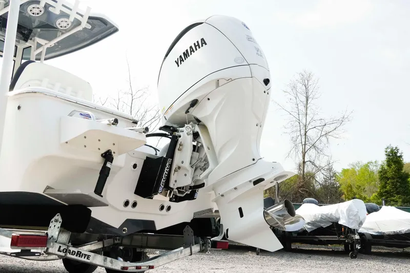 Slide: The Image of 2026 Tidewater 2300 Carolina Bay boat with Yamaha outboard engine on trailer. - 25