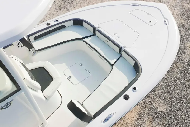 Slide: The Image of 2026 Tidewater 2300 Carolina Bay boat interior with seating and storage compartments. - 30